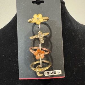 Gold and Bronze Ring Set with Floral and Cross Designs